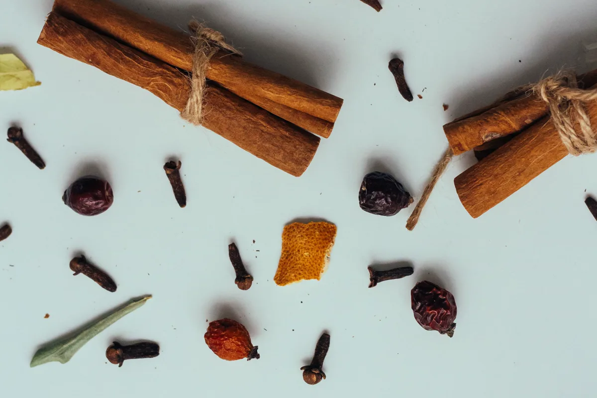 Whole dried cloves arranged with other culinary spices