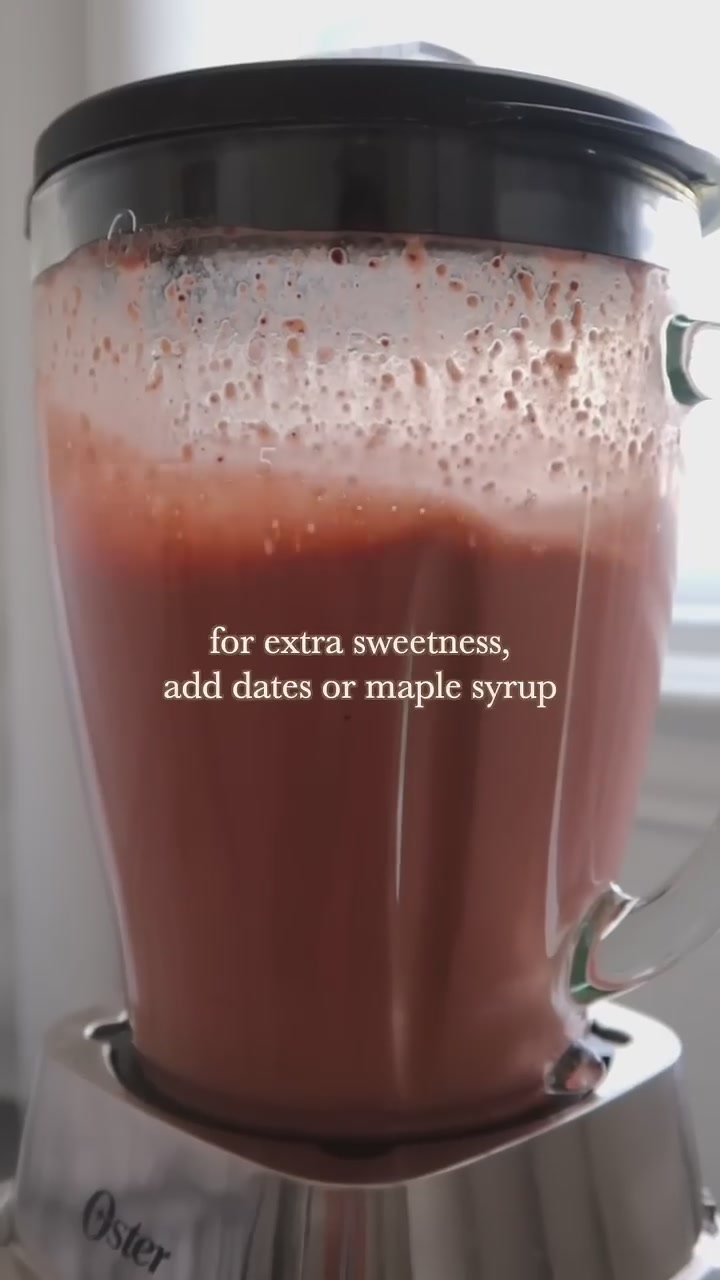 Pouring the finished smoothie into a glass